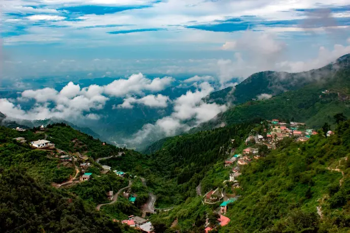 a lush Himalayan valley in Uttarakhand featuring glowing sunset hues and terraced greenery-mountain-junkey