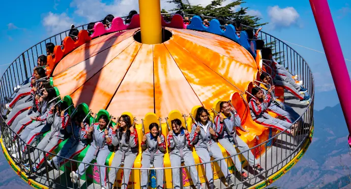 Colorful carousel swing at Kufri Fun World Jhula - Mountain Junkey
