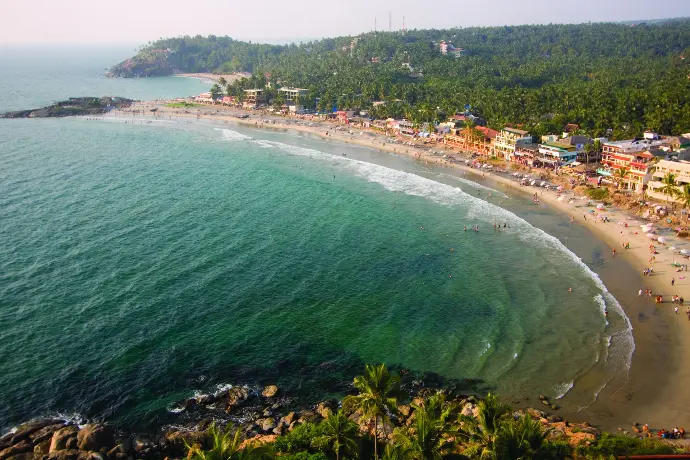 Golden sands of Bekal Beach with historic Bekal Fort backdrop - Mountain Junkey