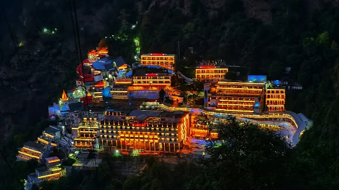Vaishno Devi shrine illuminated at night on Trikuta hills, Katra - Mountain Junkey