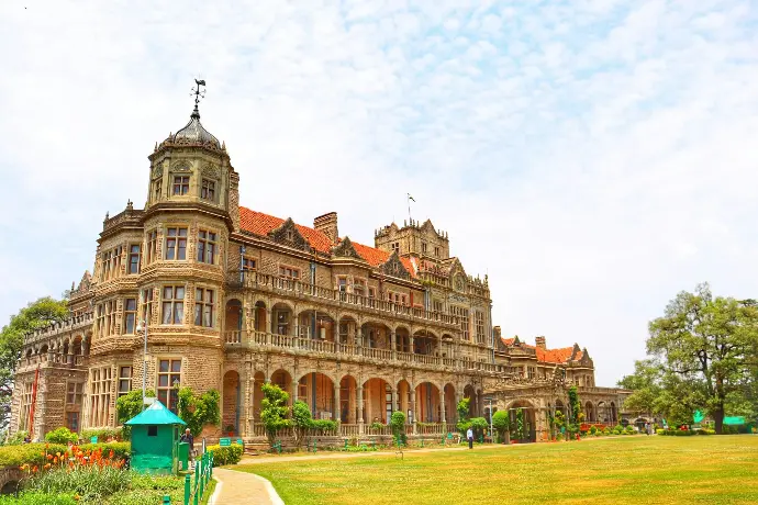 Viceregal Lodge Shimla heritage building with Mountain Junkey tour branding