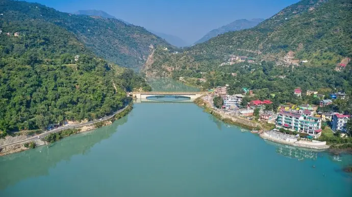 "Scenic hillside village and riverbank of Tattapani with hot springs"